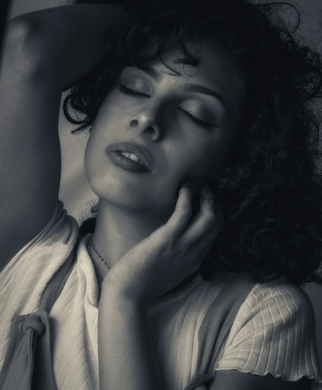 Studio portrait of a Brazilian woman mentor with curly hair