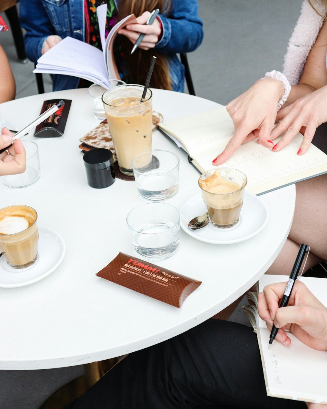 person journaling in cafe